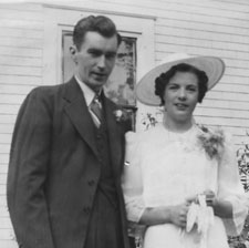 Roger Hennessy and Eileen Francis O'Toole on their wedding day, in front of the old Hennessy Homestead, Bathurst, NB.